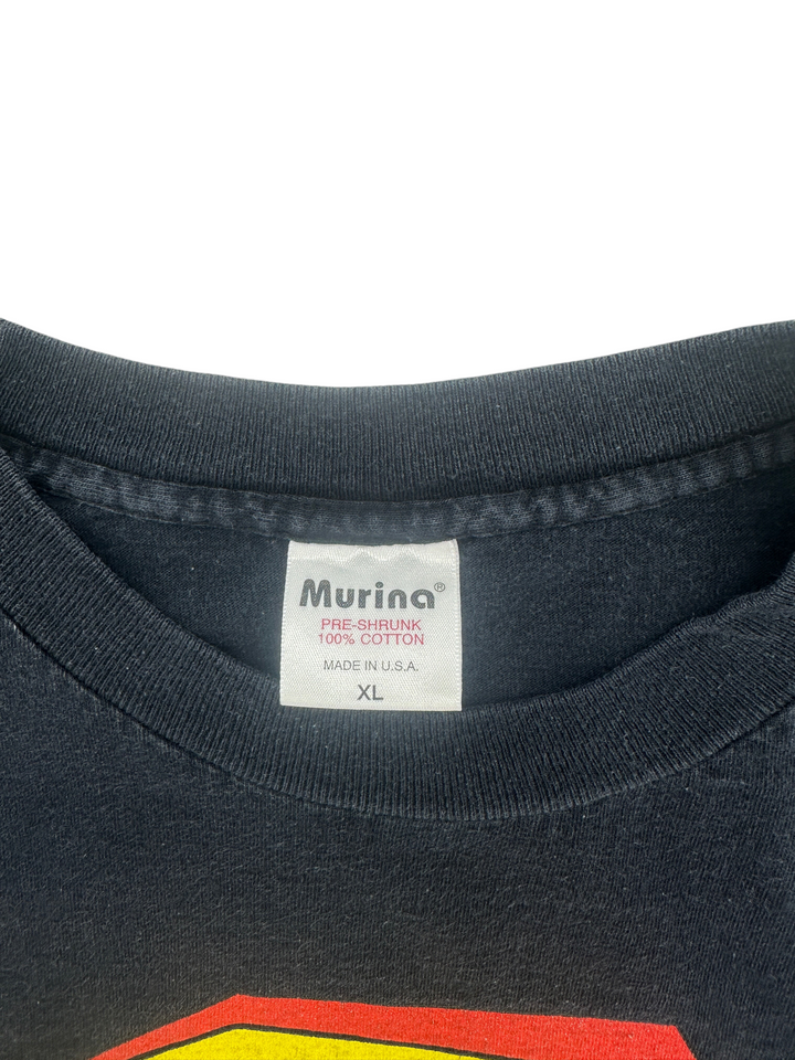 Exile Vintage 1990s The Tick T-shirt featuring a black cotton fabric and a Murina brand tag in size XL