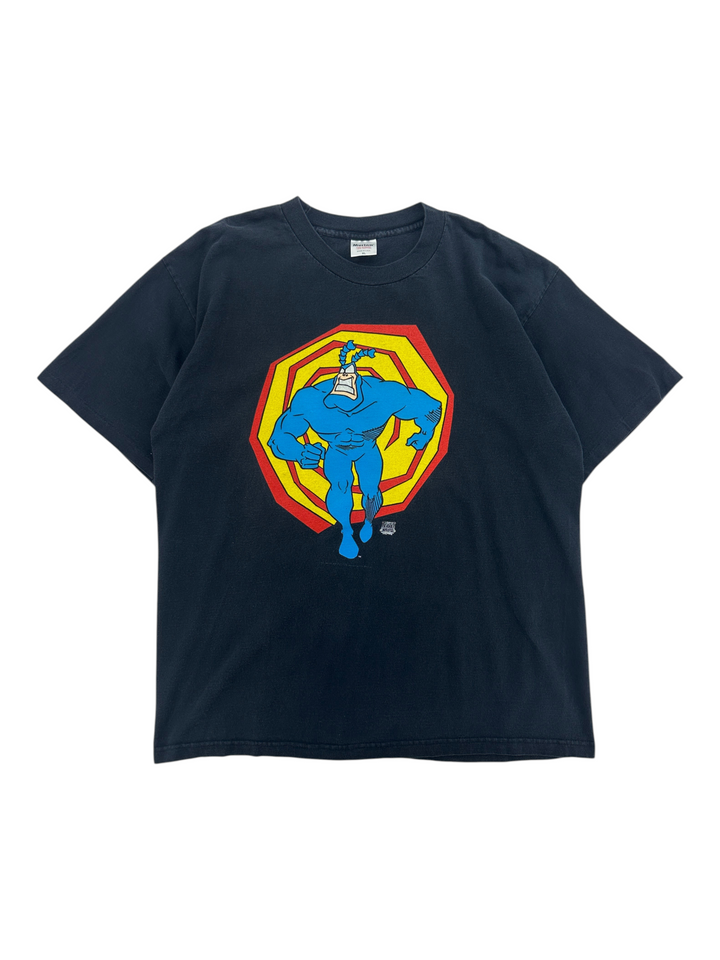 Exile Vintage black 1990s The Tick graphic t-shirt with a blue superhero character in a yellow and red target design