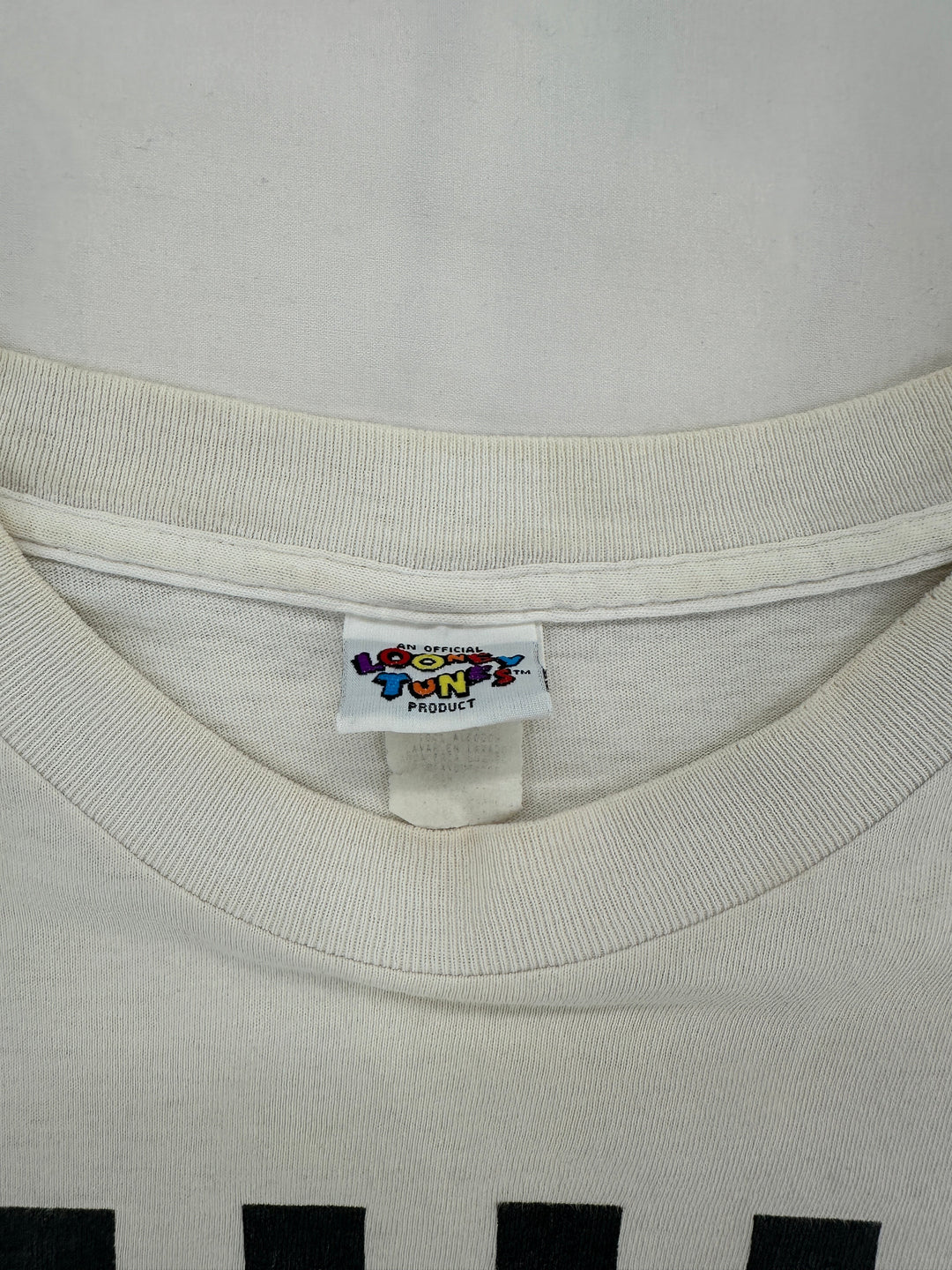 Exile Vintage white 1990s Tweety Bird gym t-shirt featuring a Looney Tunes neck label