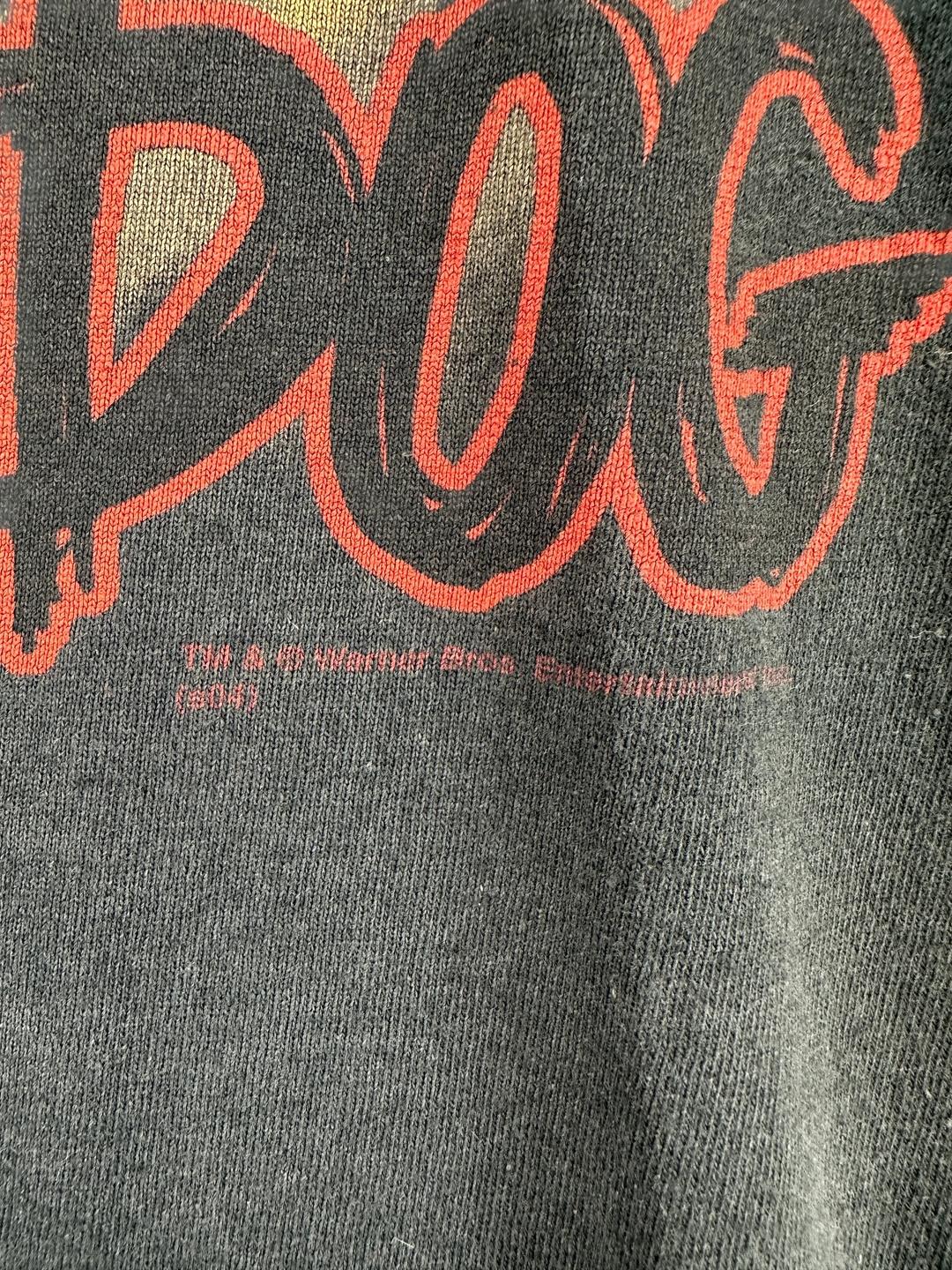 1990s Harley-Davidson x Looney Tunes t-shirt in black cotton with red graphic text and copyright details.